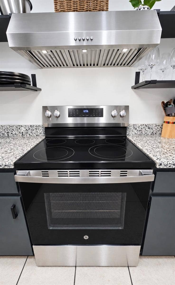 9282 SW 109TH LANE, Ocala, FL 34481 Enjoy cooking on glass top stove and upgraded hood with Bright LED lights