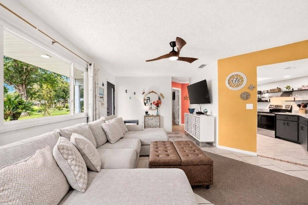 9282 SW 109TH LANE, Ocala, FL 34481 Enjoy your coffee on the cozy couch, or on the front porch-your choice-year round enjoyment