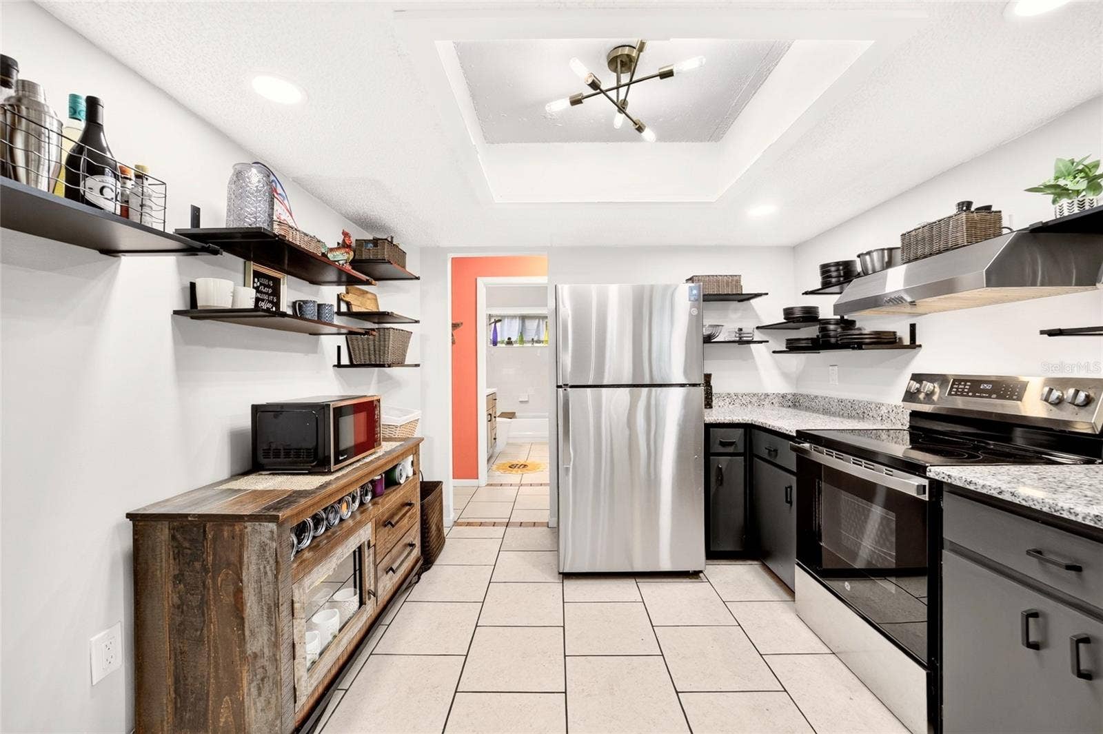 9282 SW 109TH LANE, Ocala, FL 34481 Keep it minimalist or room to add more cabinets. This functional kitchen has more storage than you notice. Keeping it airy and inviting. Lots of extra light with new LEDs in the ceiling