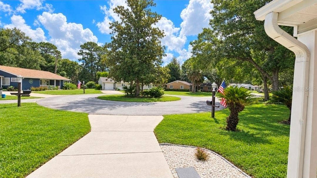 9282 SW 109TH LANE, Ocala, FL 34481 Located on quiet cul de sac with magnolia island for charm and character