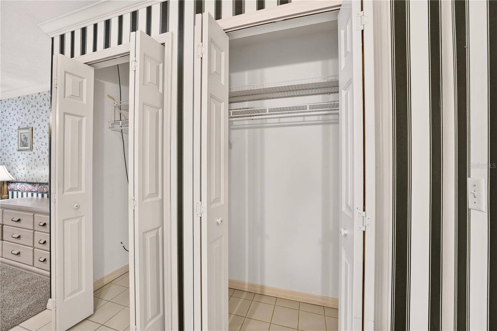 1708 NE 38TH AVENUE, Ocala, FL 34470 Two closets beside the vanity in the primary bathroom