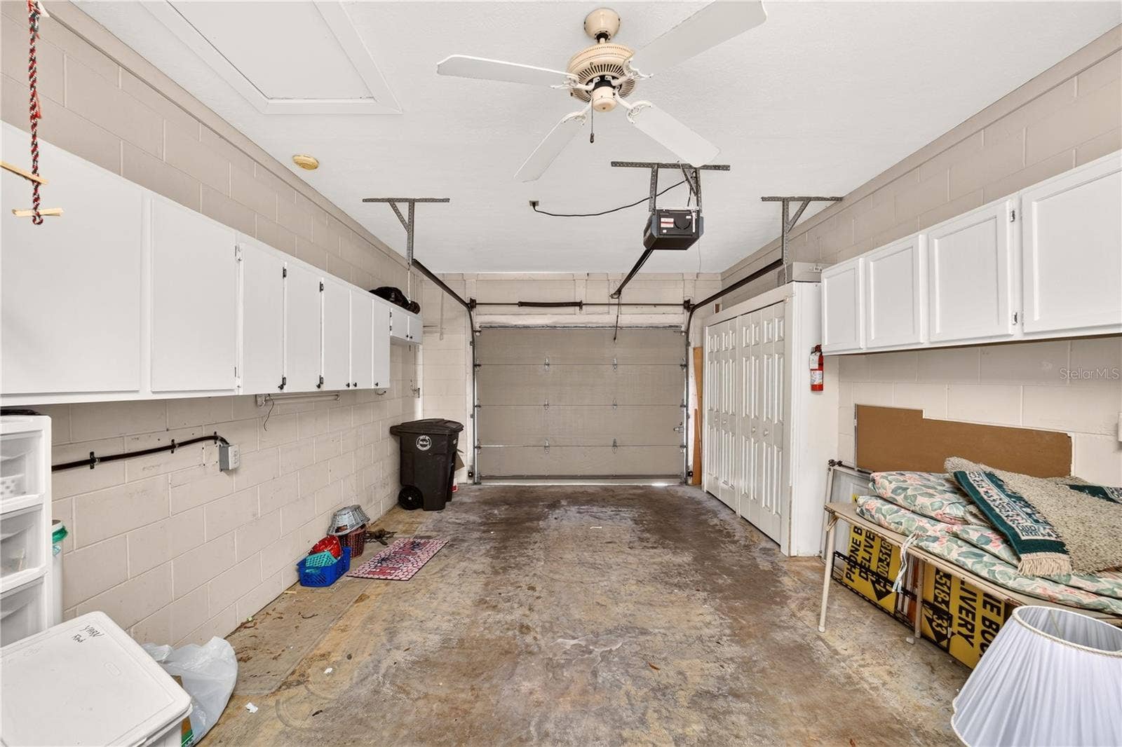 1708 NE 38TH AVENUE, Ocala, FL 34470 Garage has plenty of storage and holds the washer and dryer