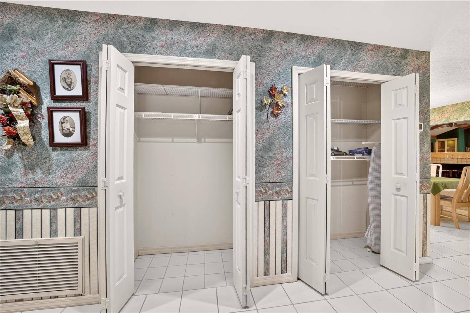 1708 NE 38TH AVENUE, Ocala, FL 34470 The hallway at the main entrance has 2 closets for storage.