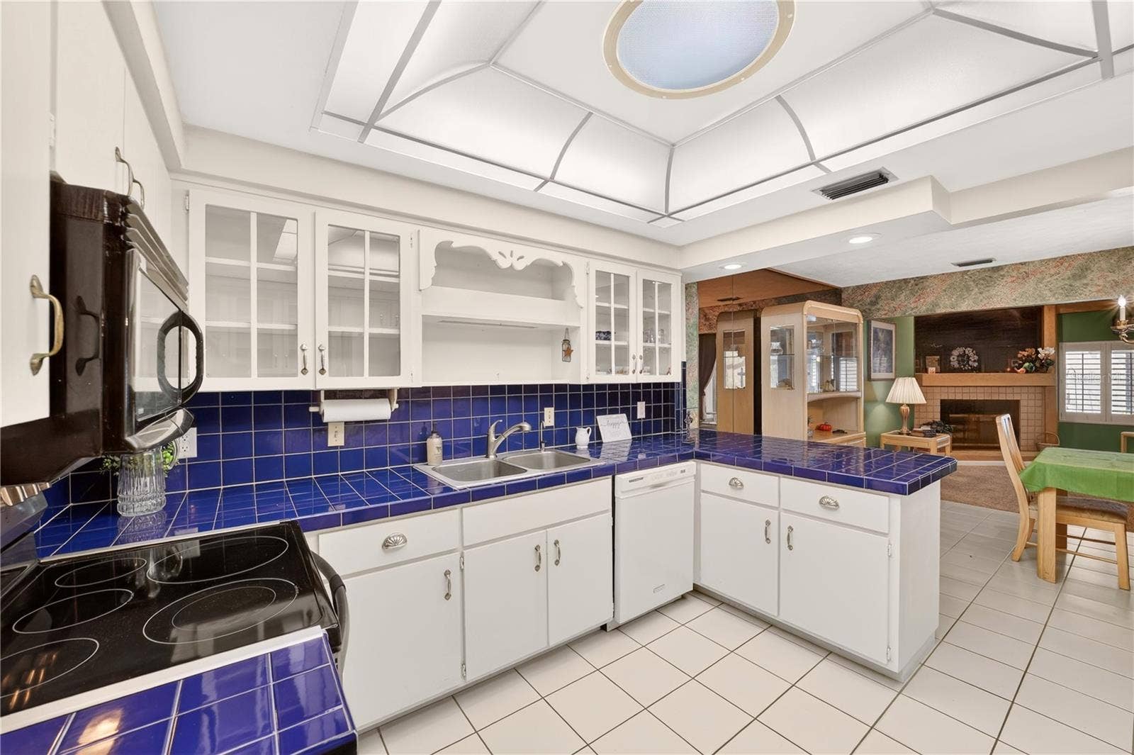 1708 NE 38TH AVENUE, Ocala, FL 34470 Spacious kitchen with tile floors, solar tube skylight and lots of cabinet space with pantry