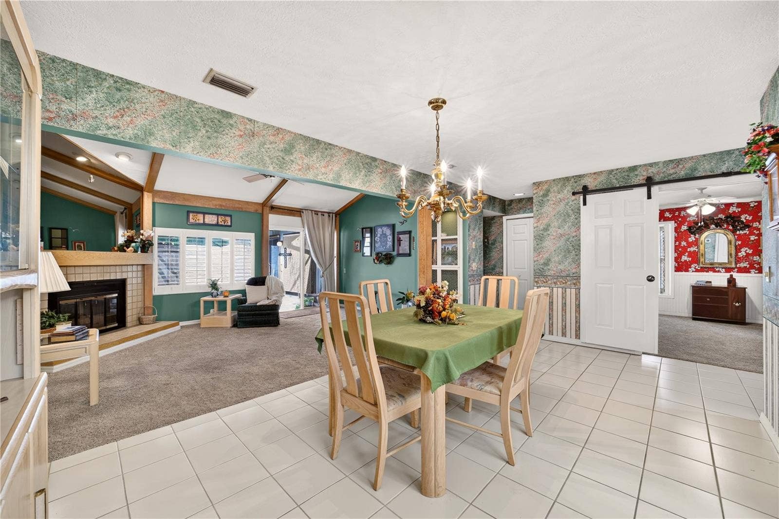 1708 NE 38TH AVENUE, Ocala, FL 34470 The dining area is tiled and right beside the living room and kitchen