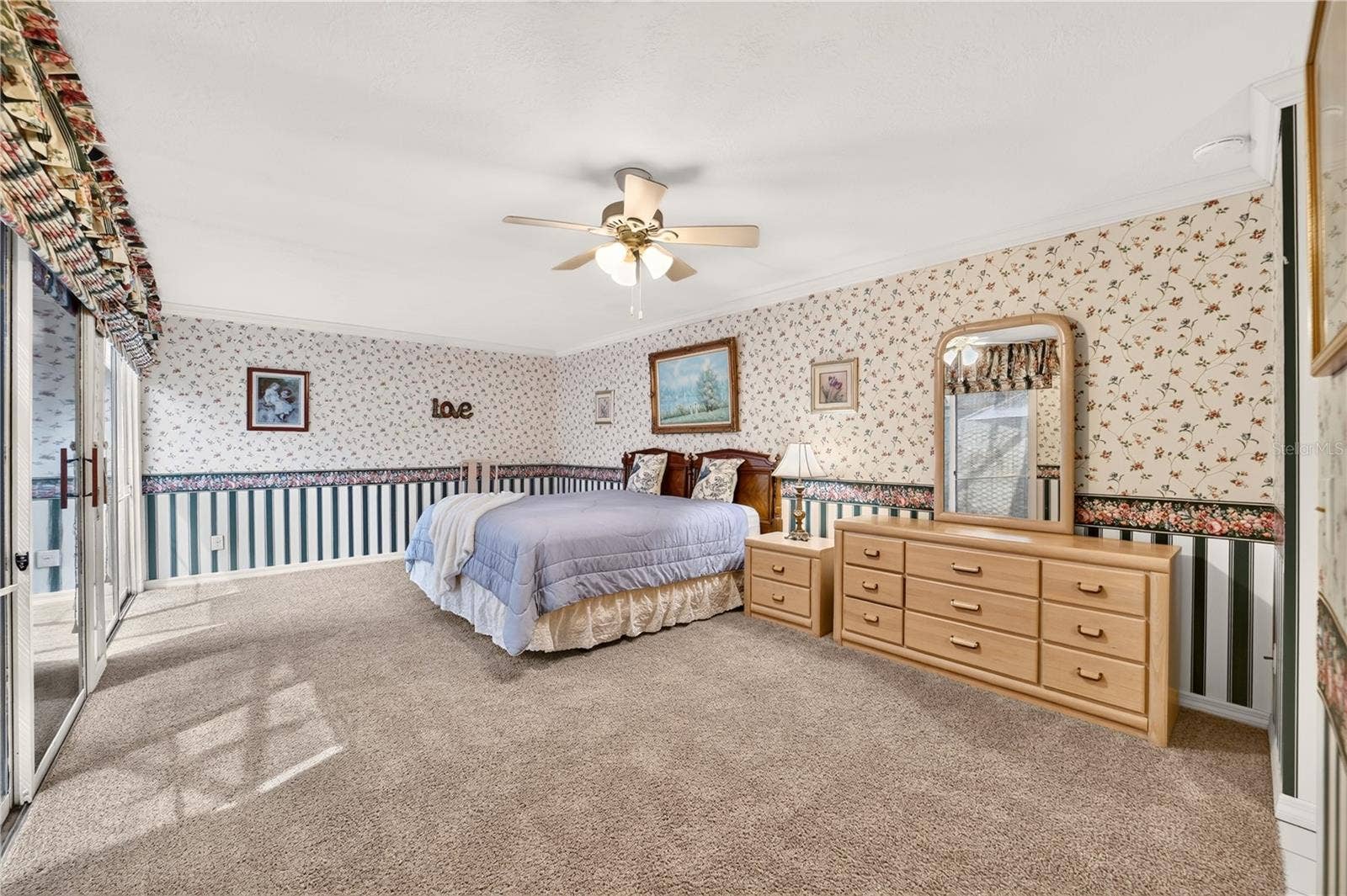 1708 NE 38TH AVENUE, Ocala, FL 34470 Extra large primary bedroom that easily fits a king size bed with room for office desk or work out equipment if desired.