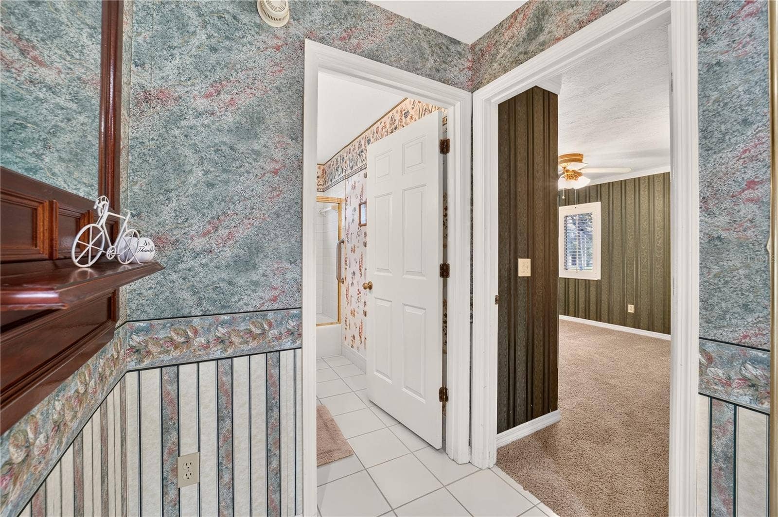 1708 NE 38TH AVENUE, Ocala, FL 34470 View into the bathroom at the entrance and front bedroom