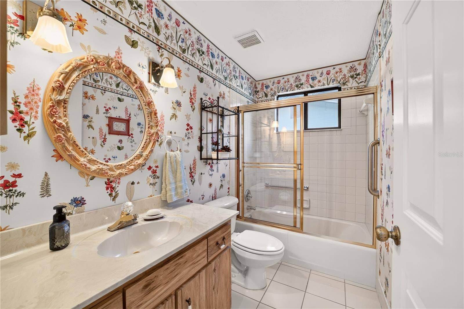 1708 NE 38TH AVENUE, Ocala, FL 34470 Guest bathroom has shower and tub combo