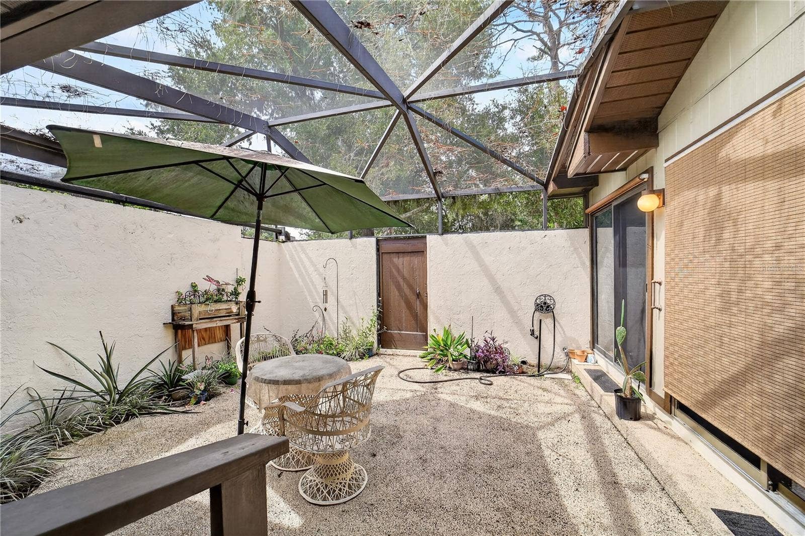 1708 NE 38TH AVENUE, Ocala, FL 34470 Back patio has screening