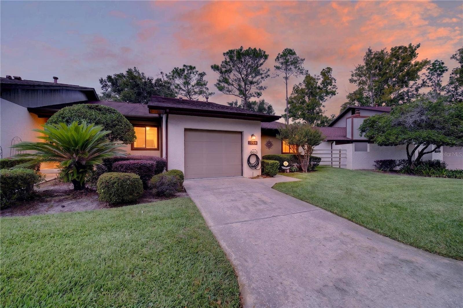 1708 NE 38TH AVENUE, Ocala, FL 34470 View of home at dusk