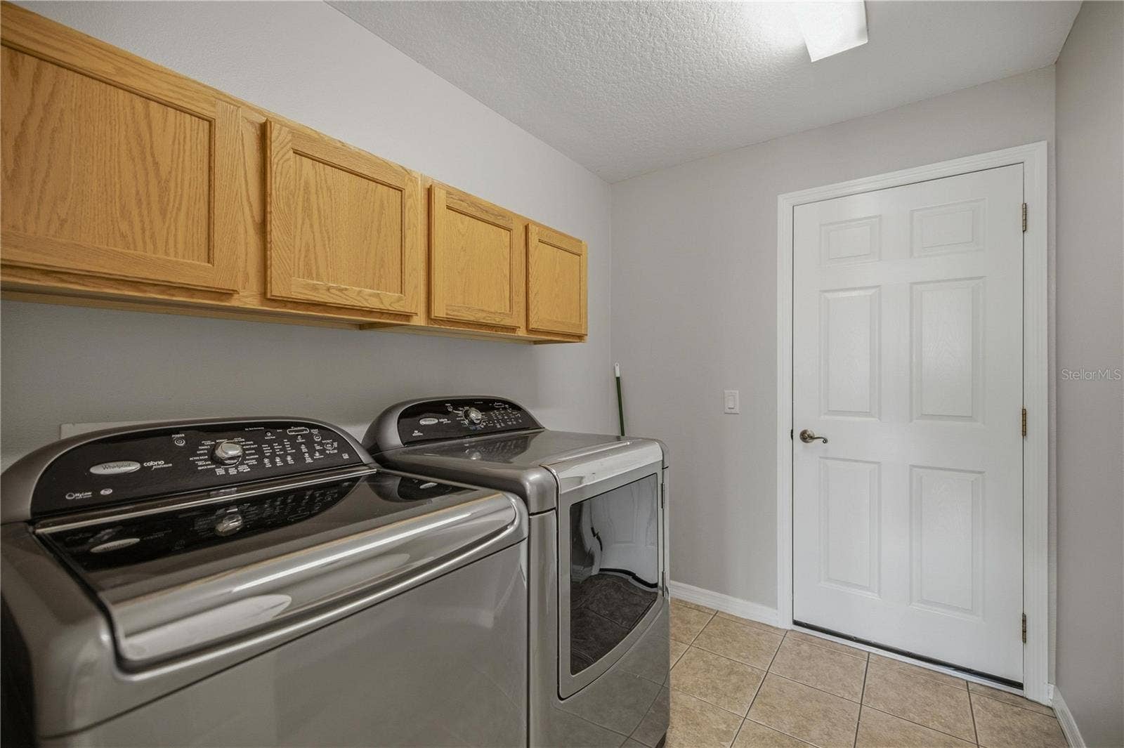 15673 SW 11TH TERRACE ROAD, Ocala, FL 34473 Laundry room off Kitchen