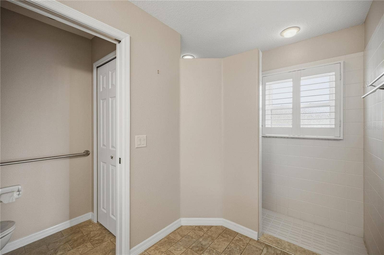 15673 SW 11TH TERRACE ROAD, Ocala, FL 34473 Primary bathroom with walk-in shower and private water closet