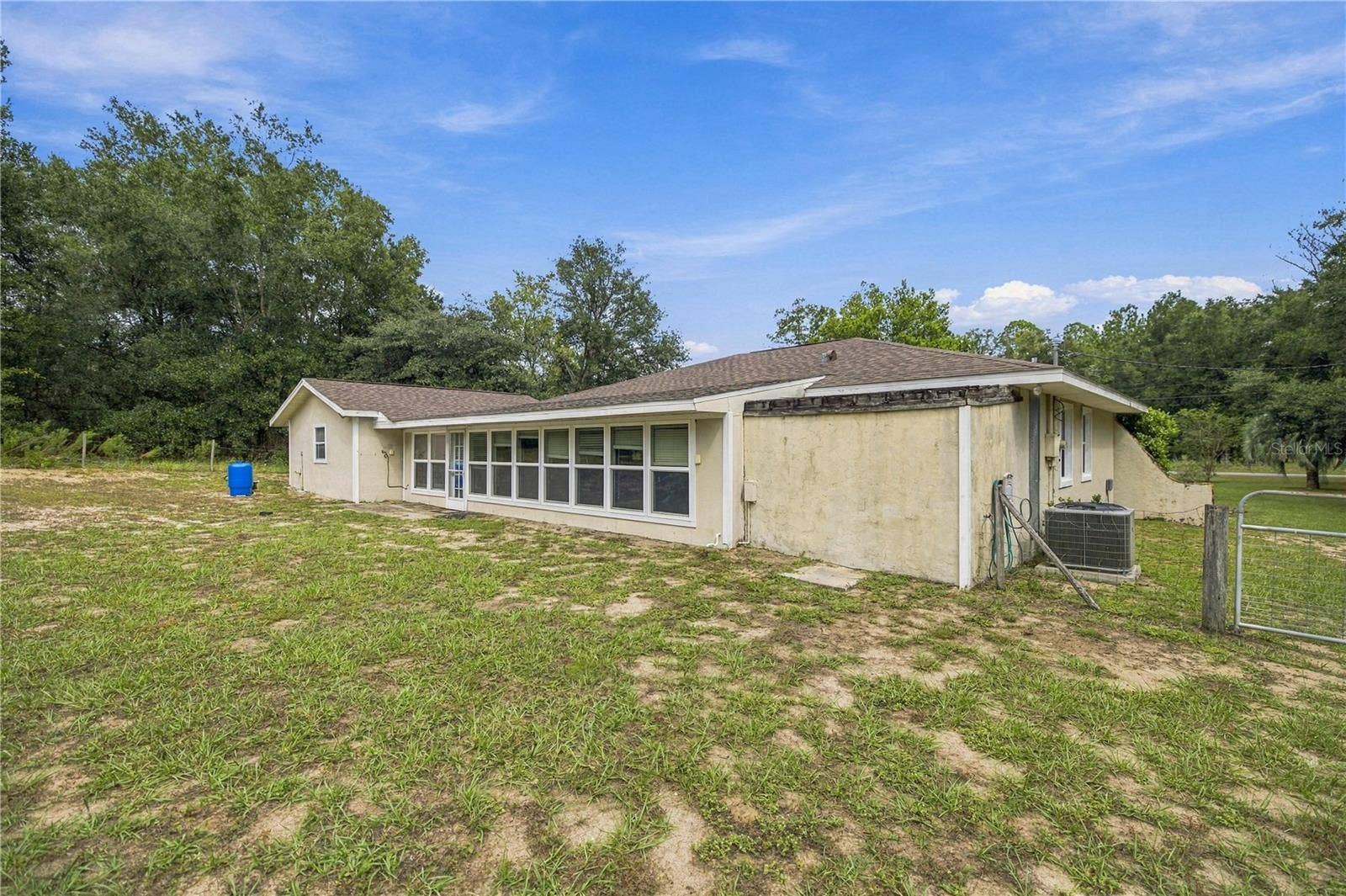 7910 SW 202ND COURT, Dunnellon, FL 34431 SW CORNER OF HOUSE LOOKING FORWARD TO GATE AND 2ND DRIVEWAY