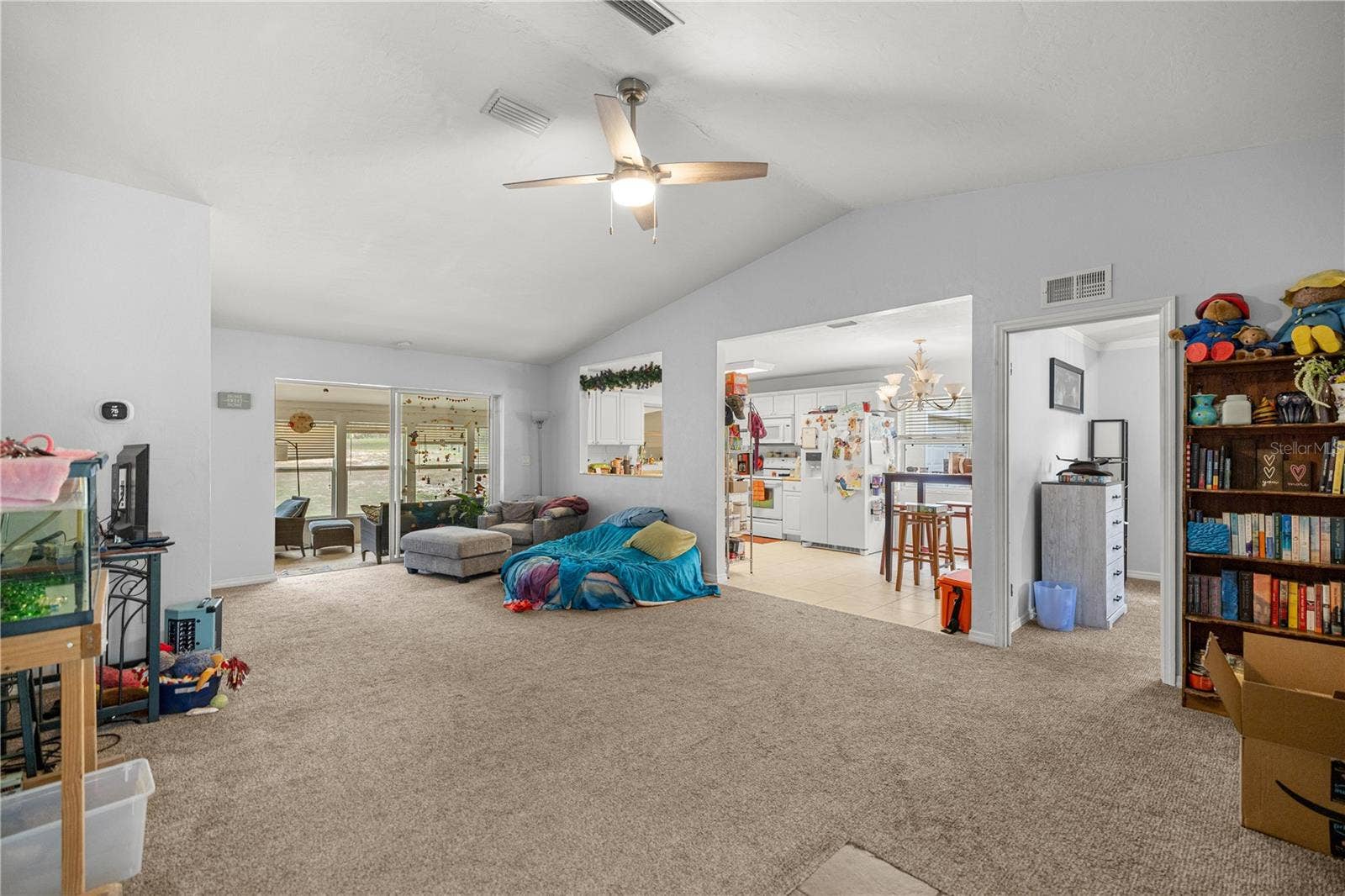 7910 SW 202ND COURT, Dunnellon, FL 34431 FROM FOYER LOOKING THRU LIVING AREA TO SUNROOM & KITCHEN