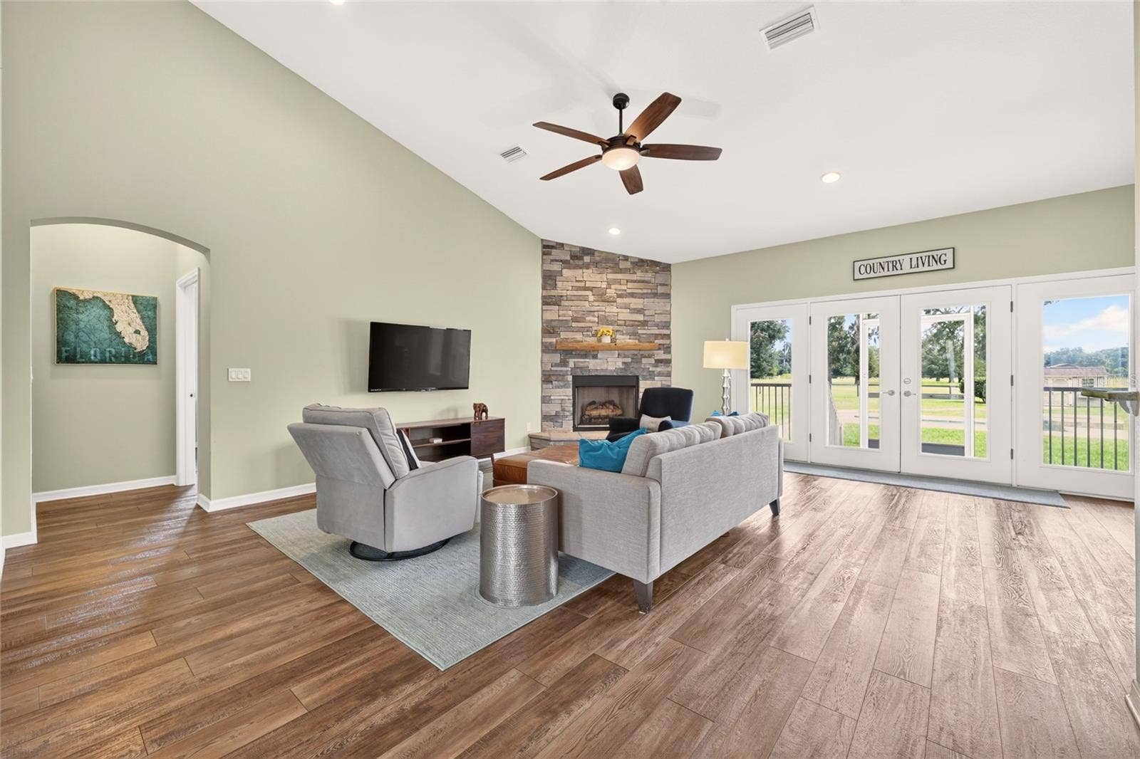 2556 NE 120TH STREET, Anthony, FL 32617 Open concept living area enjoys natural light and beautiful views of the east pastures.