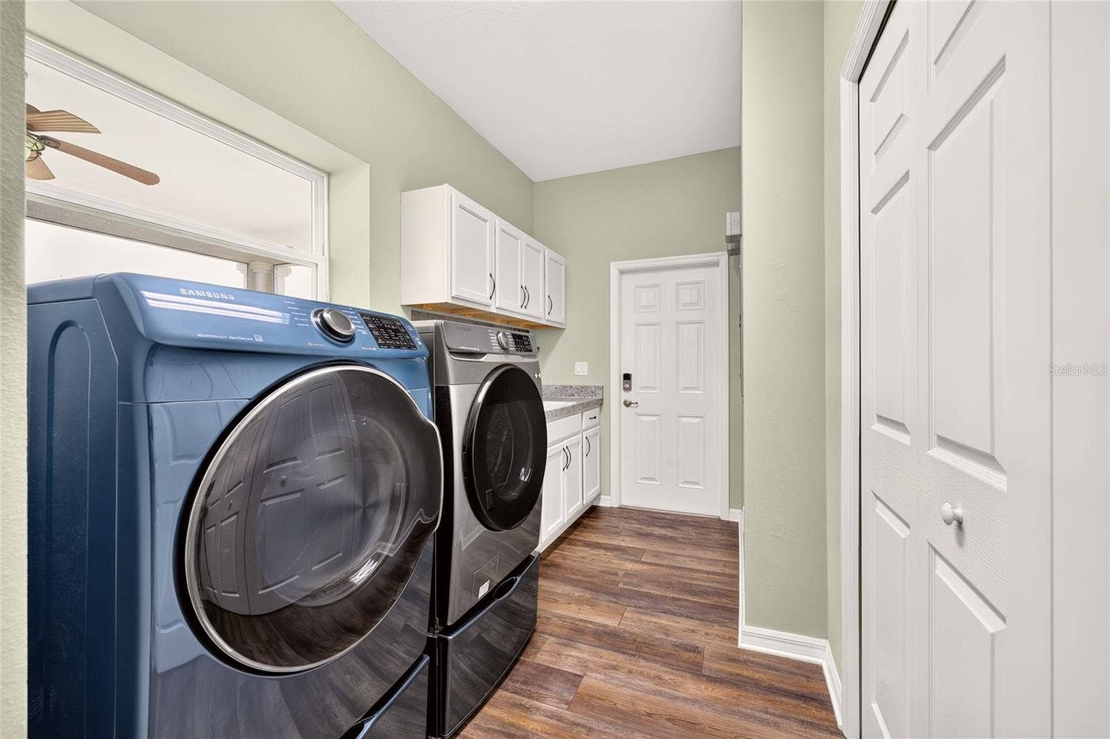 2556 NE 120TH STREET, Anthony, FL 32617 Large Laundry offers another storage closet, cabinet space, washtub, and direct access to the side yard - perfect for pets!