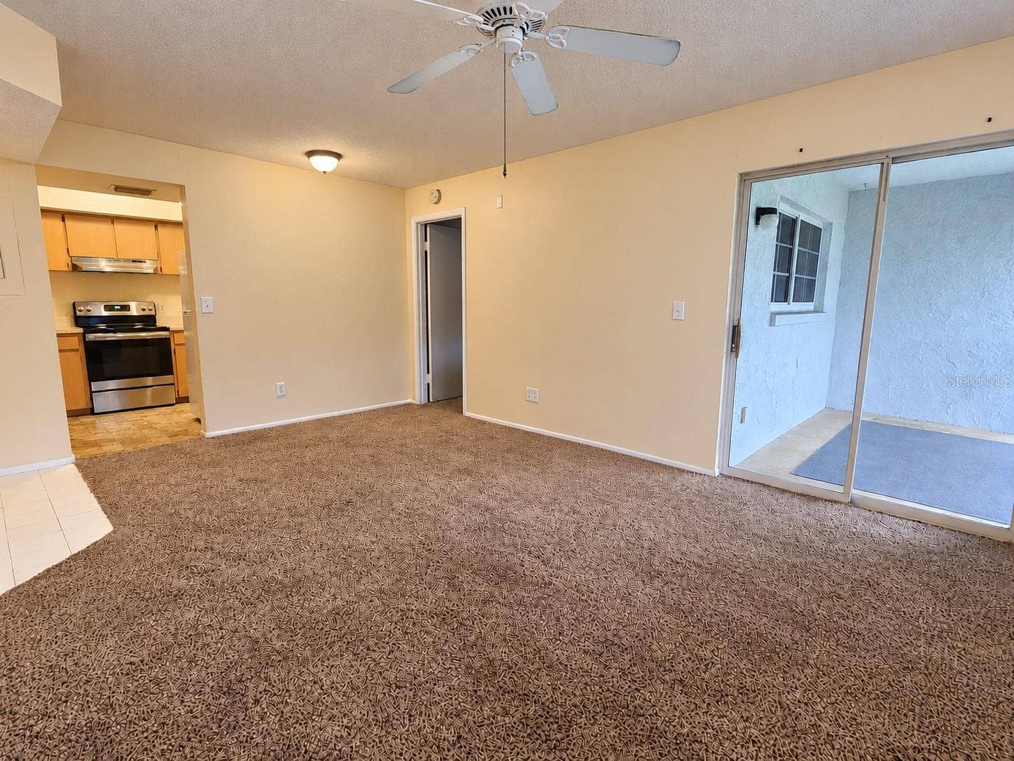 580 FAIRWAYS LANE, #G204, Ocala, FL 34472 Living Room to Kitchen