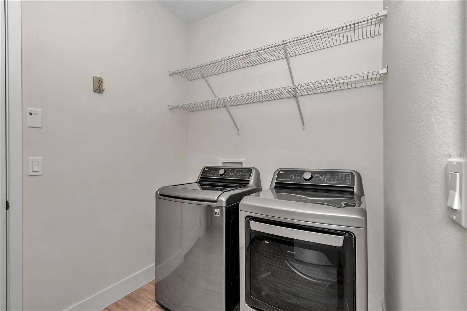 Extended laundry room with sink and storage
