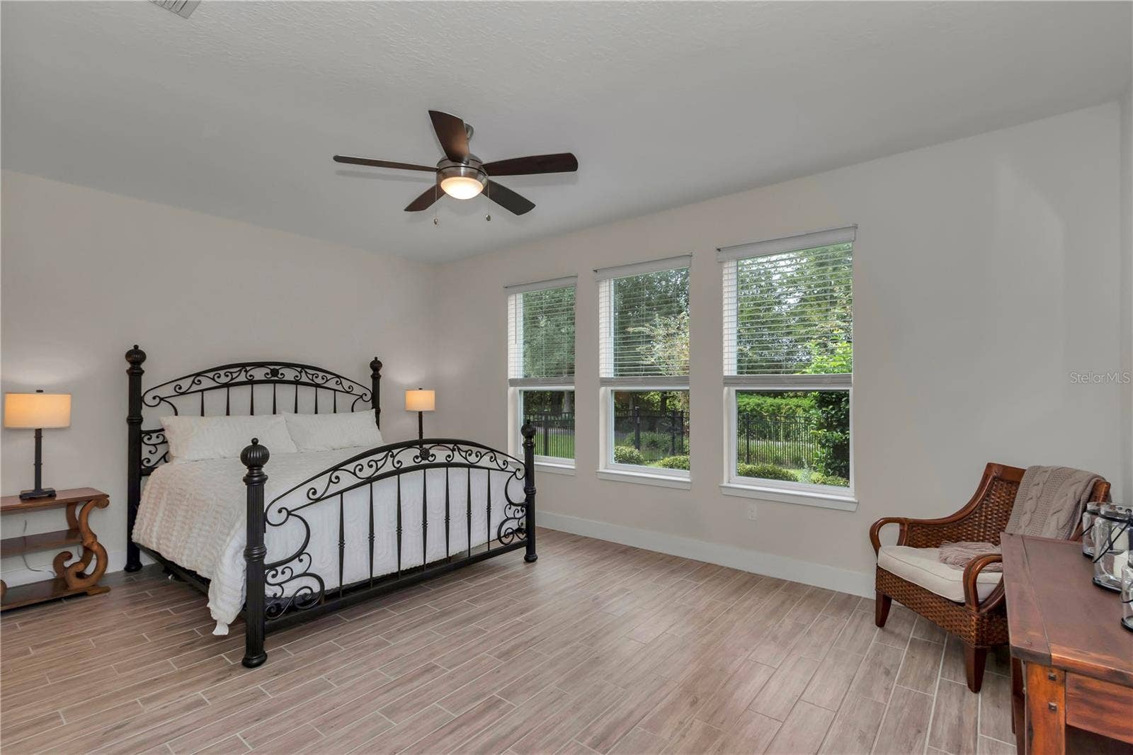 Large primary suite with garden views