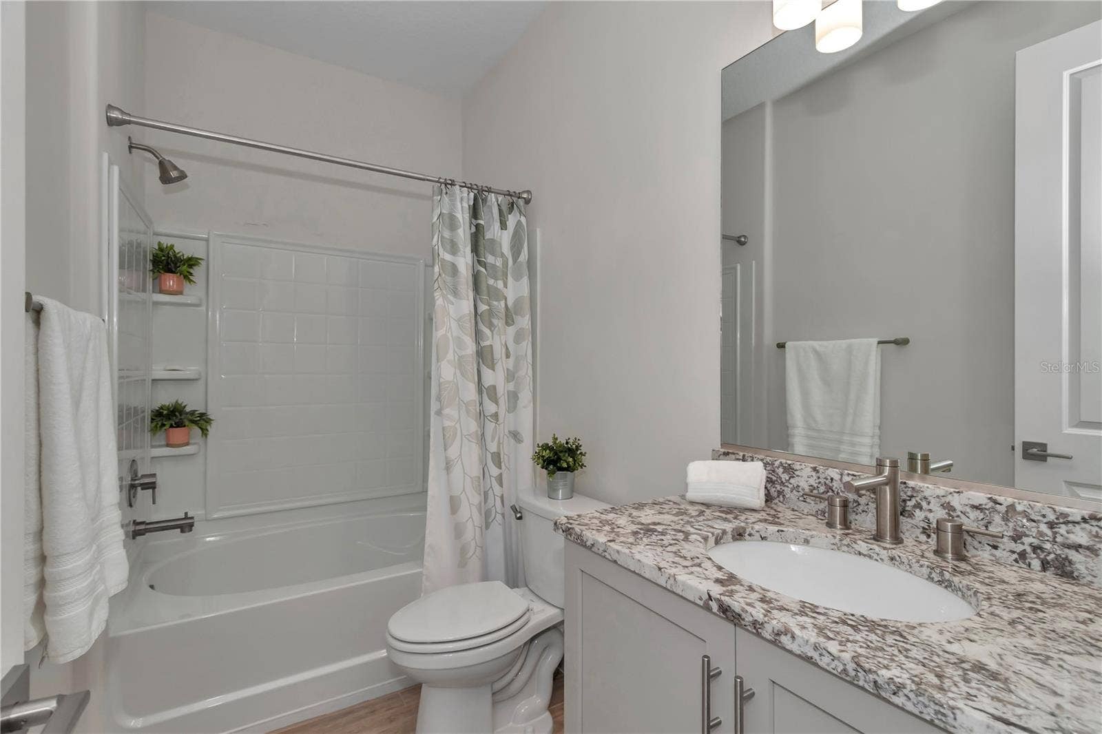 Full bath located between bedroom 2 & bedroom 3
