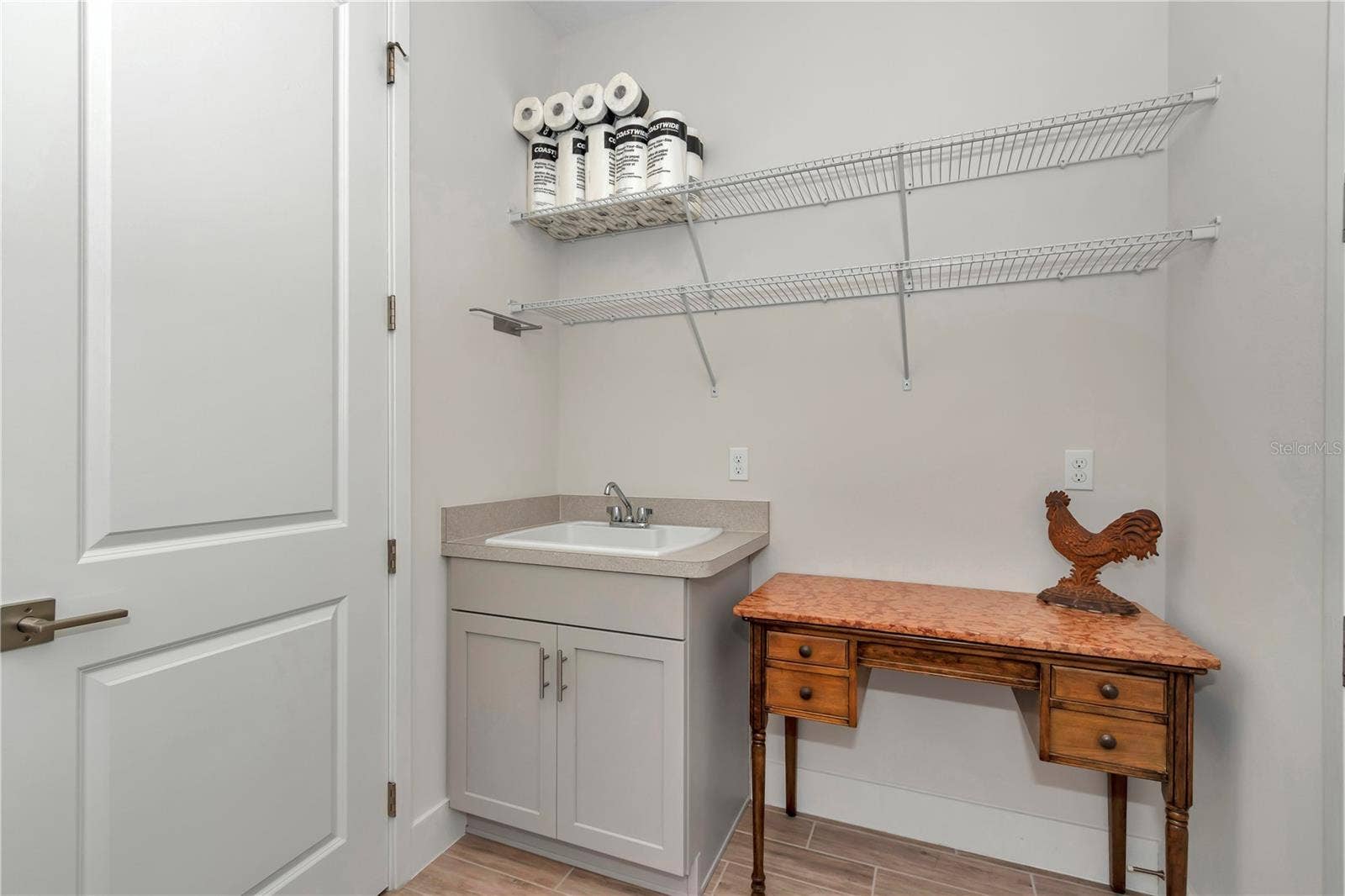 Extended Laundry room with sink and storage