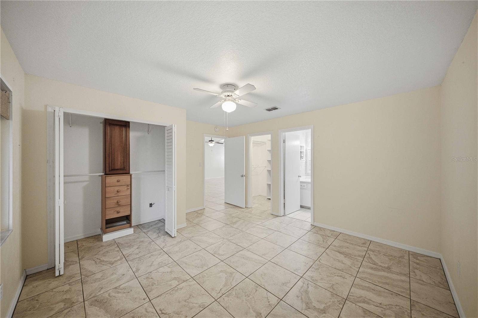 2nd closet with organizer in primary bedroom