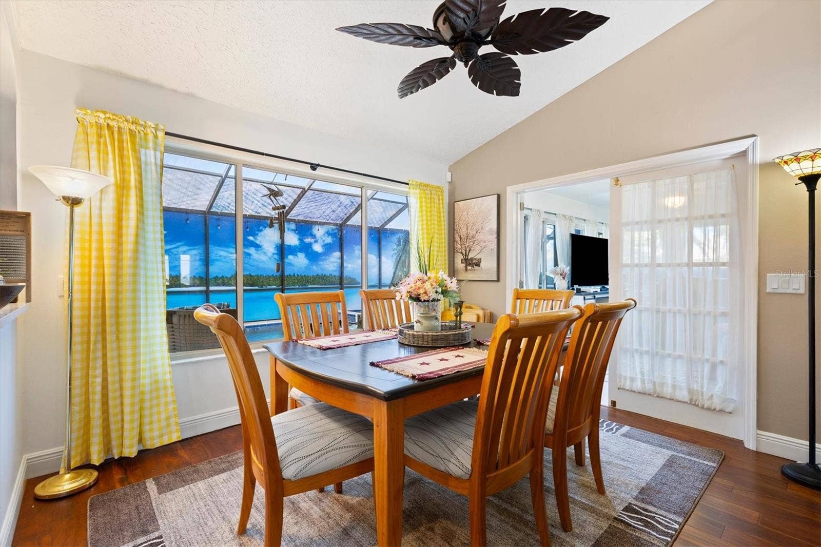 17432 SE 112TH COURT, Summerfield, FL 34491 Dining room with view of outside oasis through window. Under air lanai through the French doors to the right.