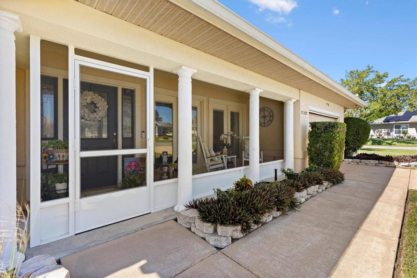 17432 SE 112TH COURT, Summerfield, FL 34491 Screened front porch.
