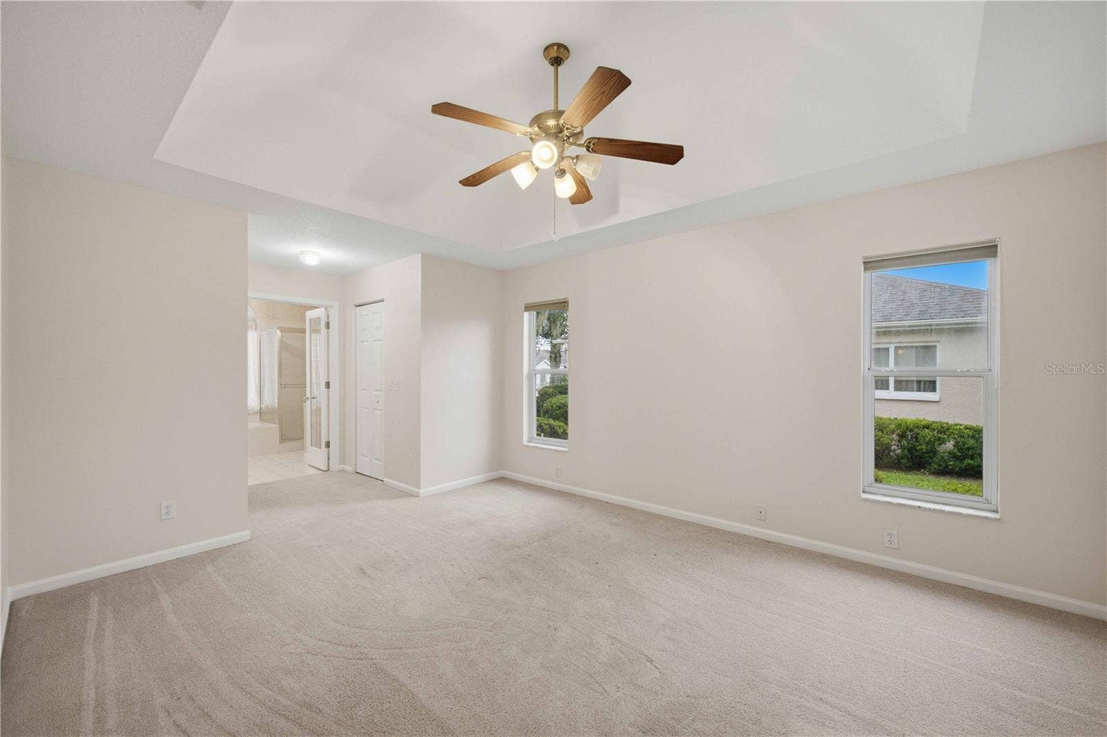 5126 NW 21ST LOOP, Ocala, FL 34482 Primary bedroom with tray ceiling