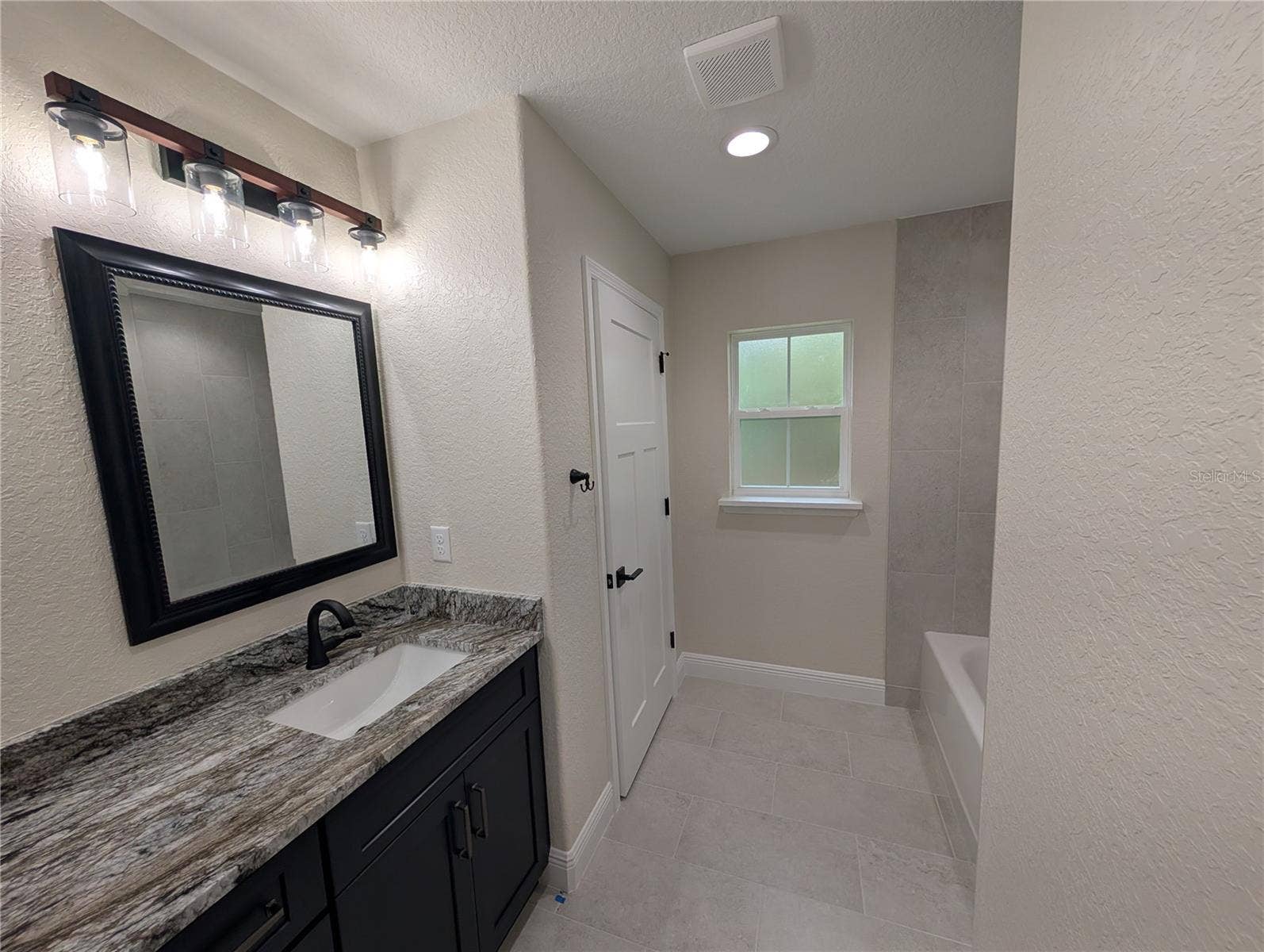 Photos are of same model  Fixtures, colors, flooring will vary