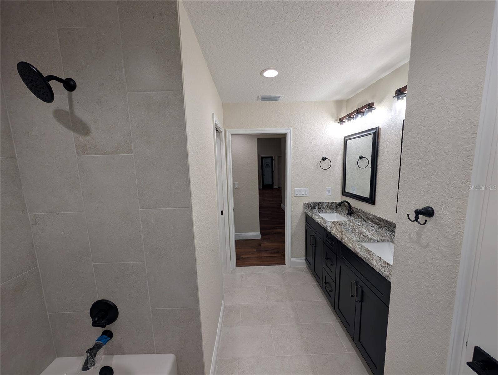 Photos are of same model  Fixtures, colors, flooring will vary