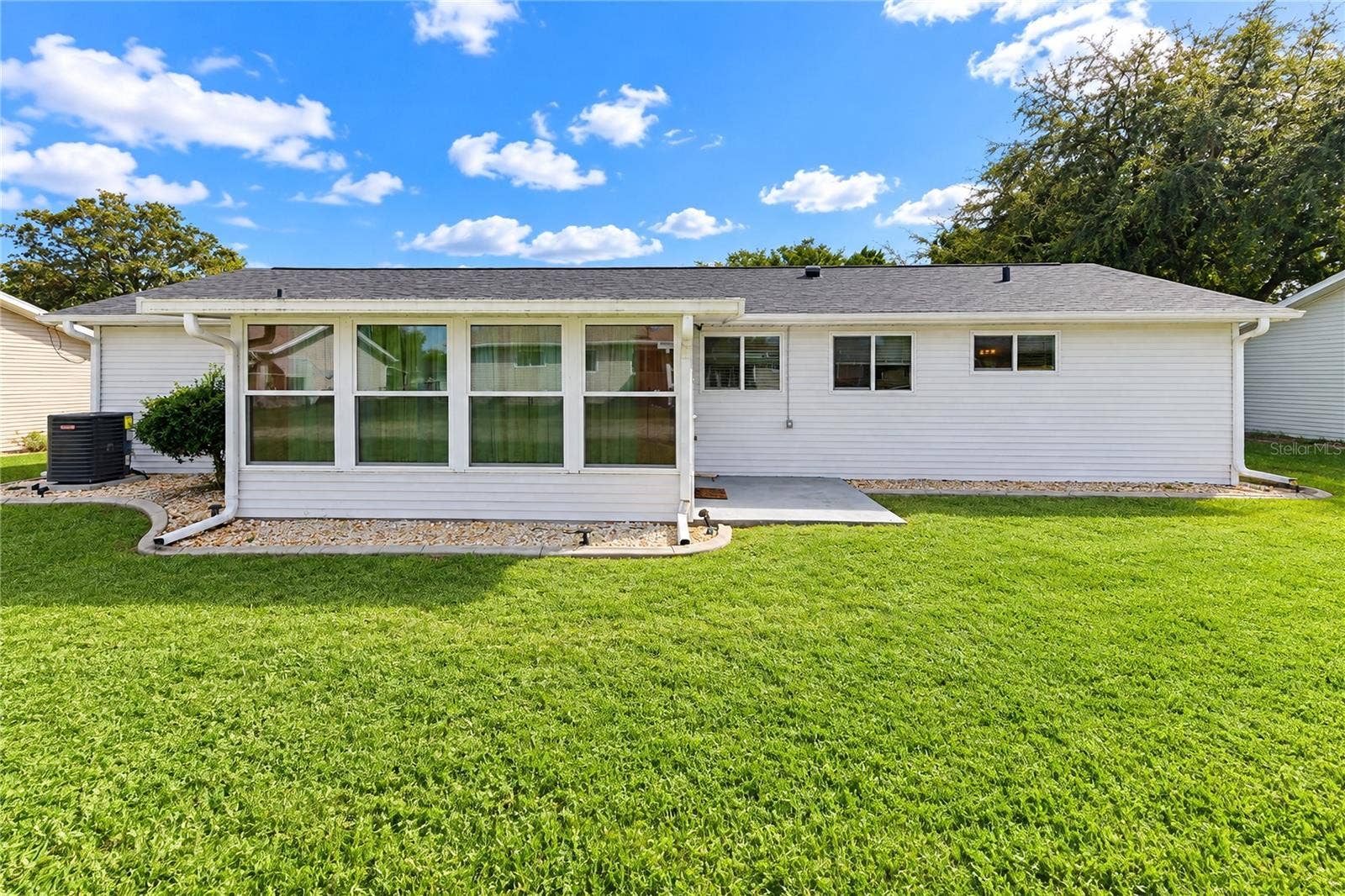 8169 SW 108TH LANE ROAD, Ocala, FL 34481 Rear glass enclosed patio view