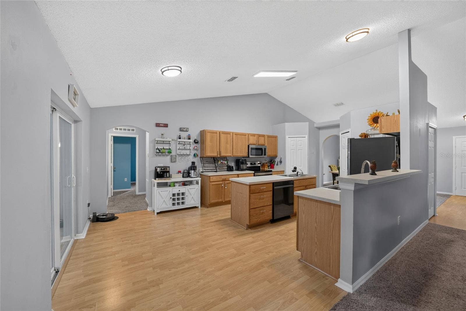 Kitchen with Dual Pantries and Center Island with Double Sink