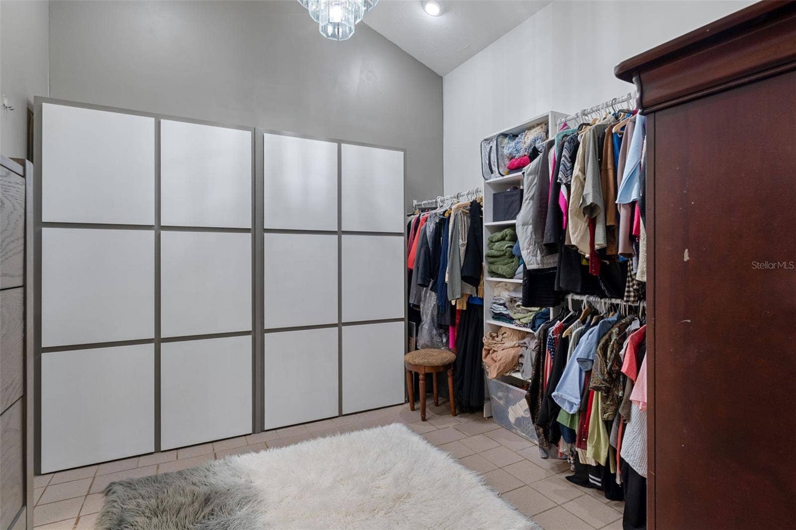 Primary bedroom walk-in closet