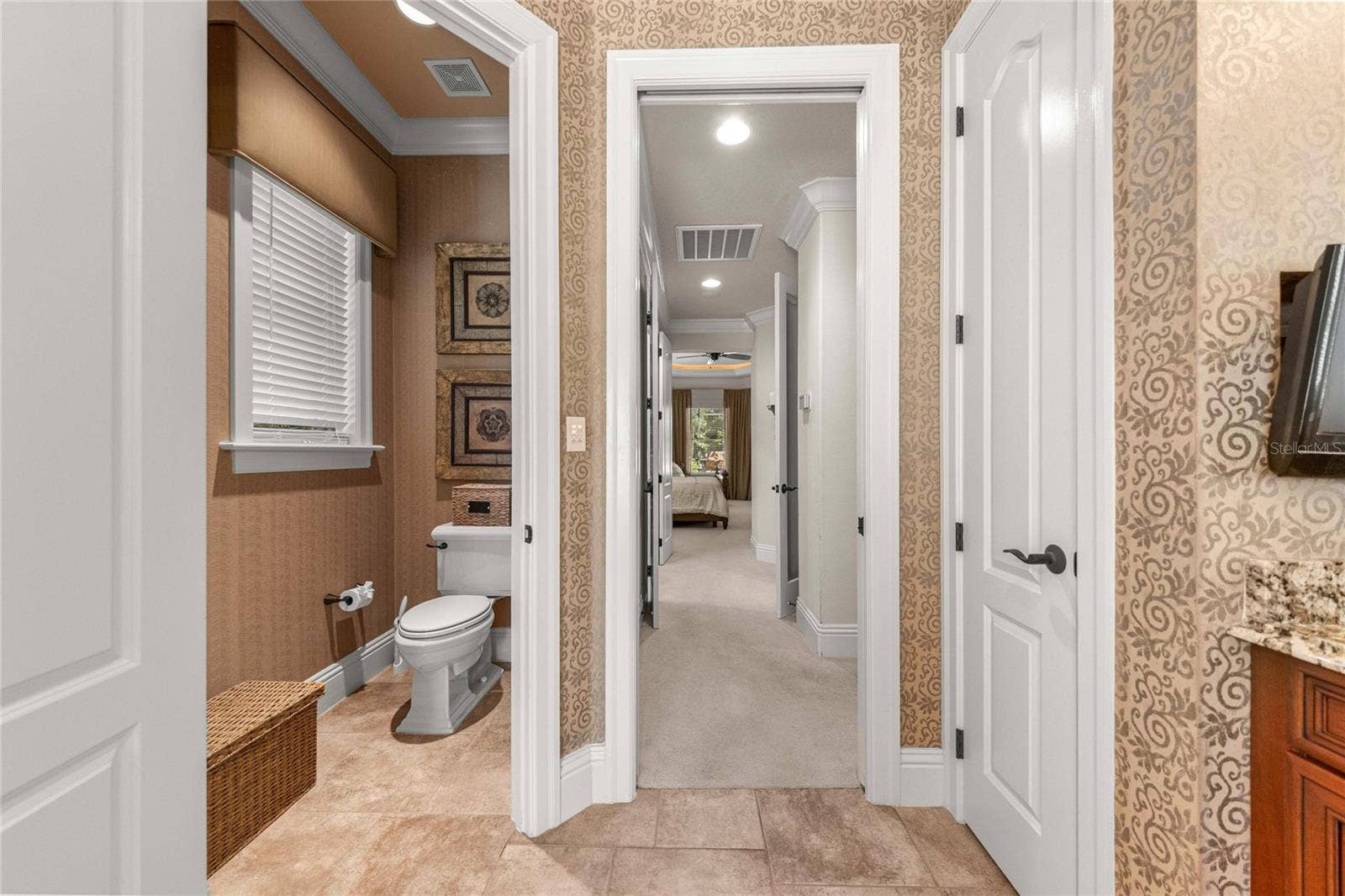 Thoughtfully designed owner's bathroom with separate water closet and convenient access to the primary suite.