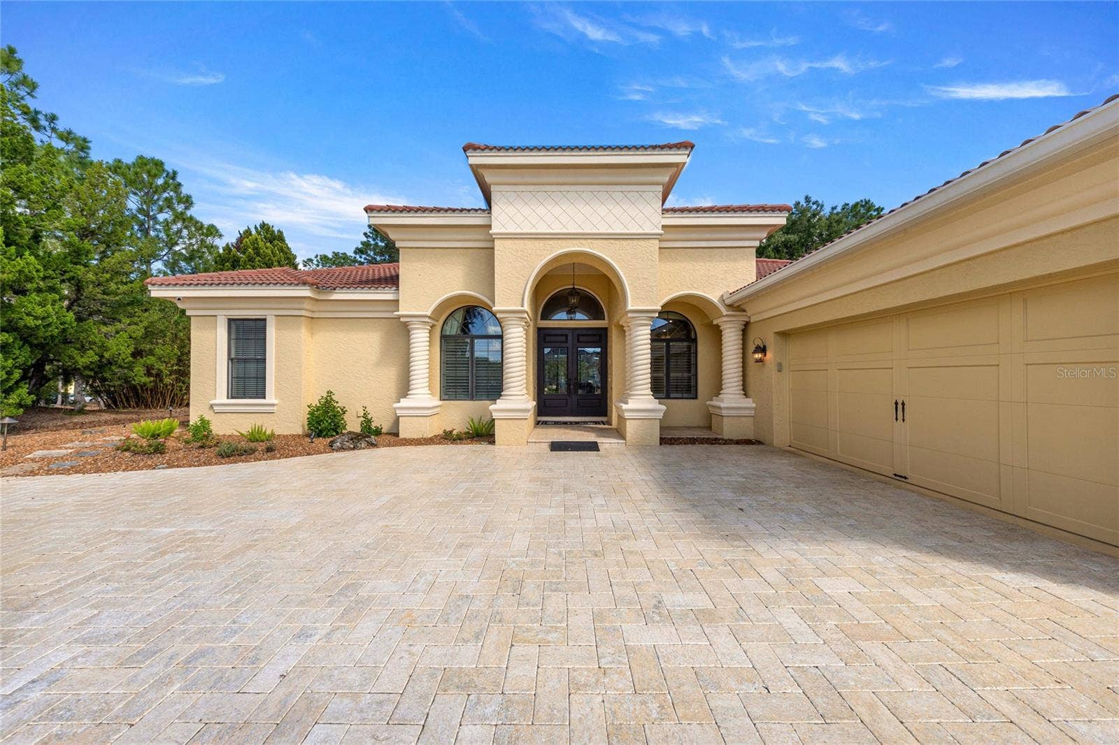 Front view with two car garage