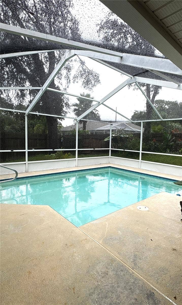 8919 N MENDOZA WAY, Citrus Springs, FL 34434 Pool screen room attached to screened and tiled lanai.