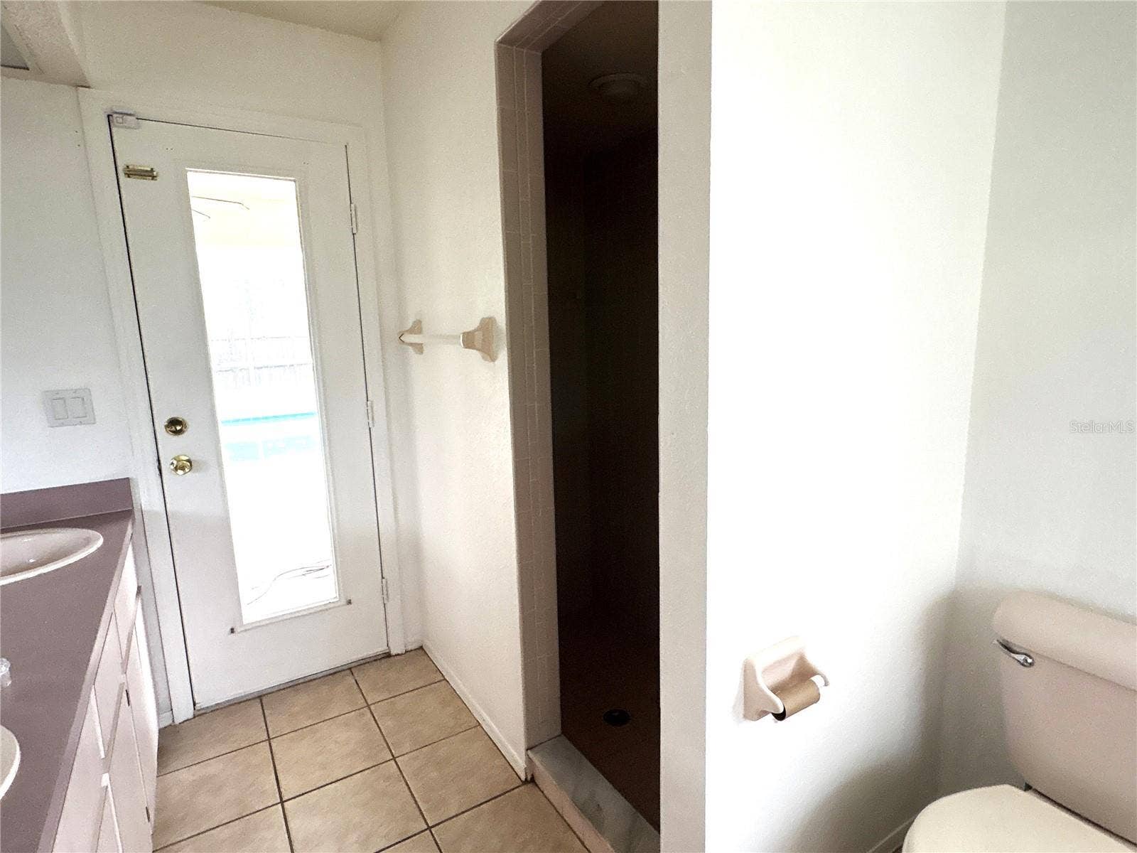 8919 N MENDOZA WAY, Citrus Springs, FL 34434 shower area with access to lanai.