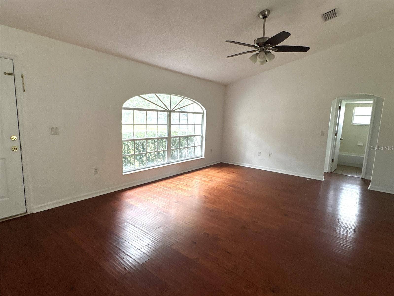 8919 N MENDOZA WAY, Citrus Springs, FL 34434 Looking across the living room.