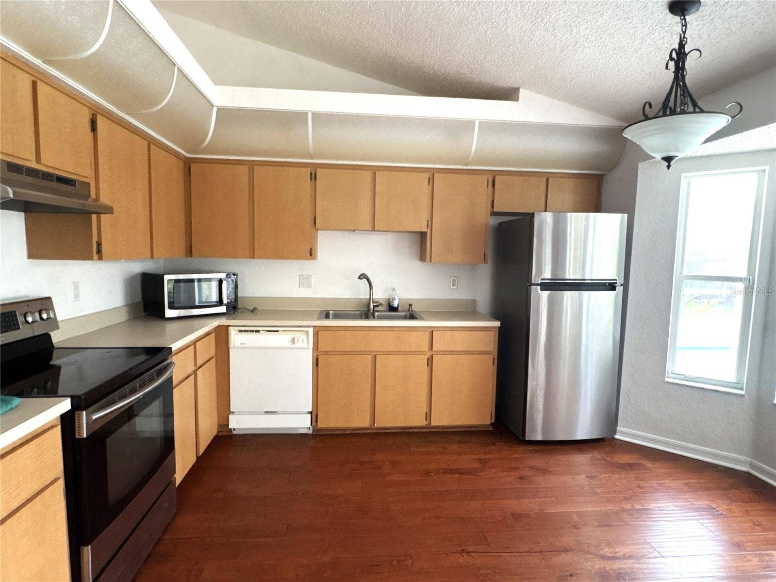 8919 N MENDOZA WAY, Citrus Springs, FL 34434 Open kitchen with small eat in kitchen area.