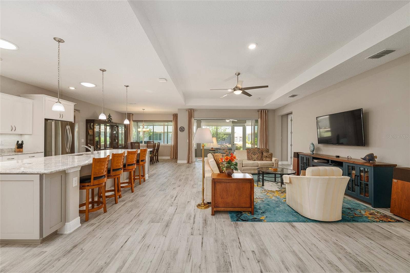 Expansive open-concept design seamlessly connects the kitchen, dining area, and great room, creating an inviting space for everyday comfort, effortless entertaining, and gathering with family and friends.