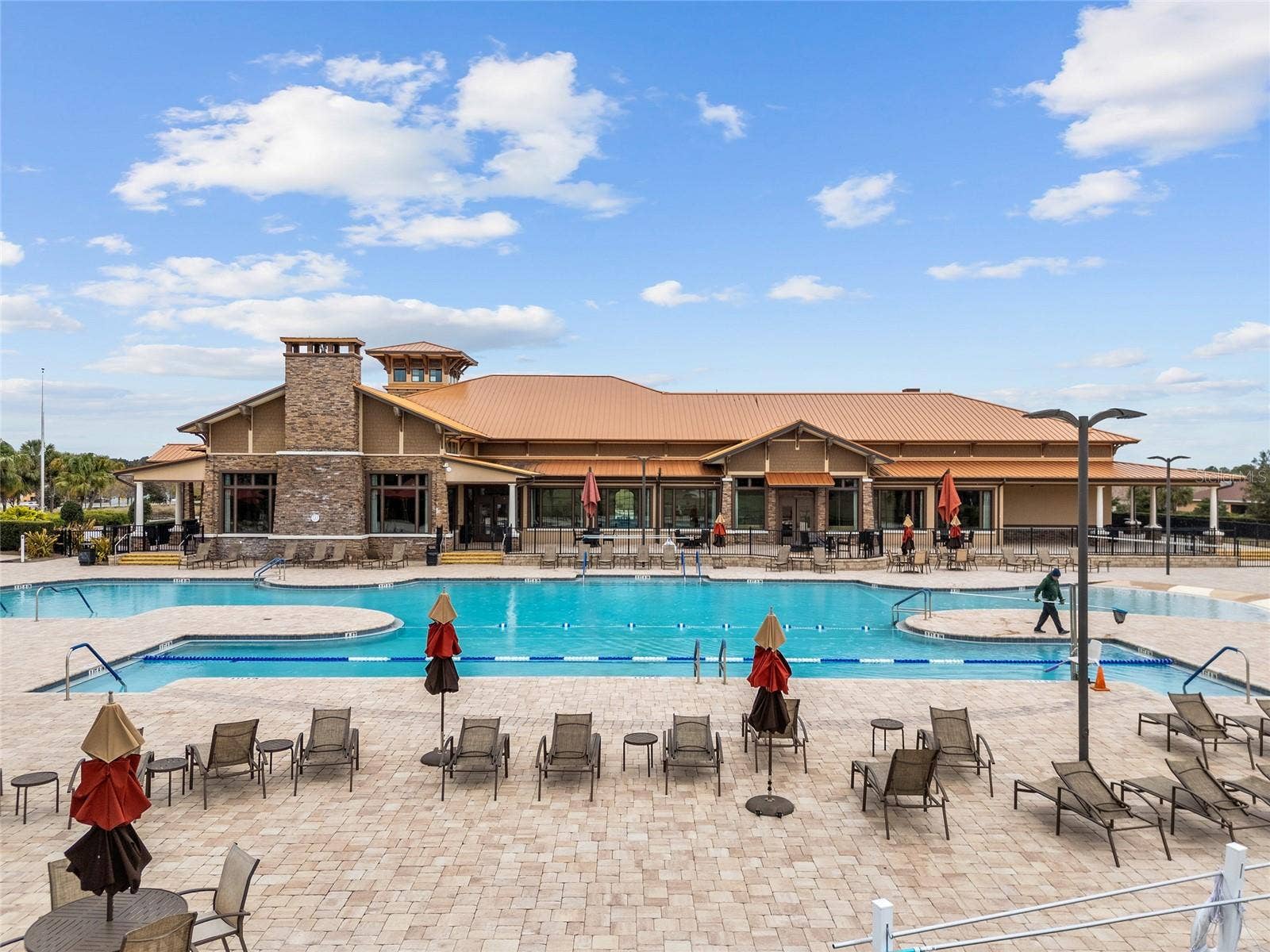 Enjoy resort-style living at the Candler Hills heated swimming pool, featuring dedicated lap lanes, beach-entry access, an expansive pool deck, and plenty of lounge seating. The beautiful setting overlooking The Lodge offers the perfect place for swimming, relaxation, and socializing.