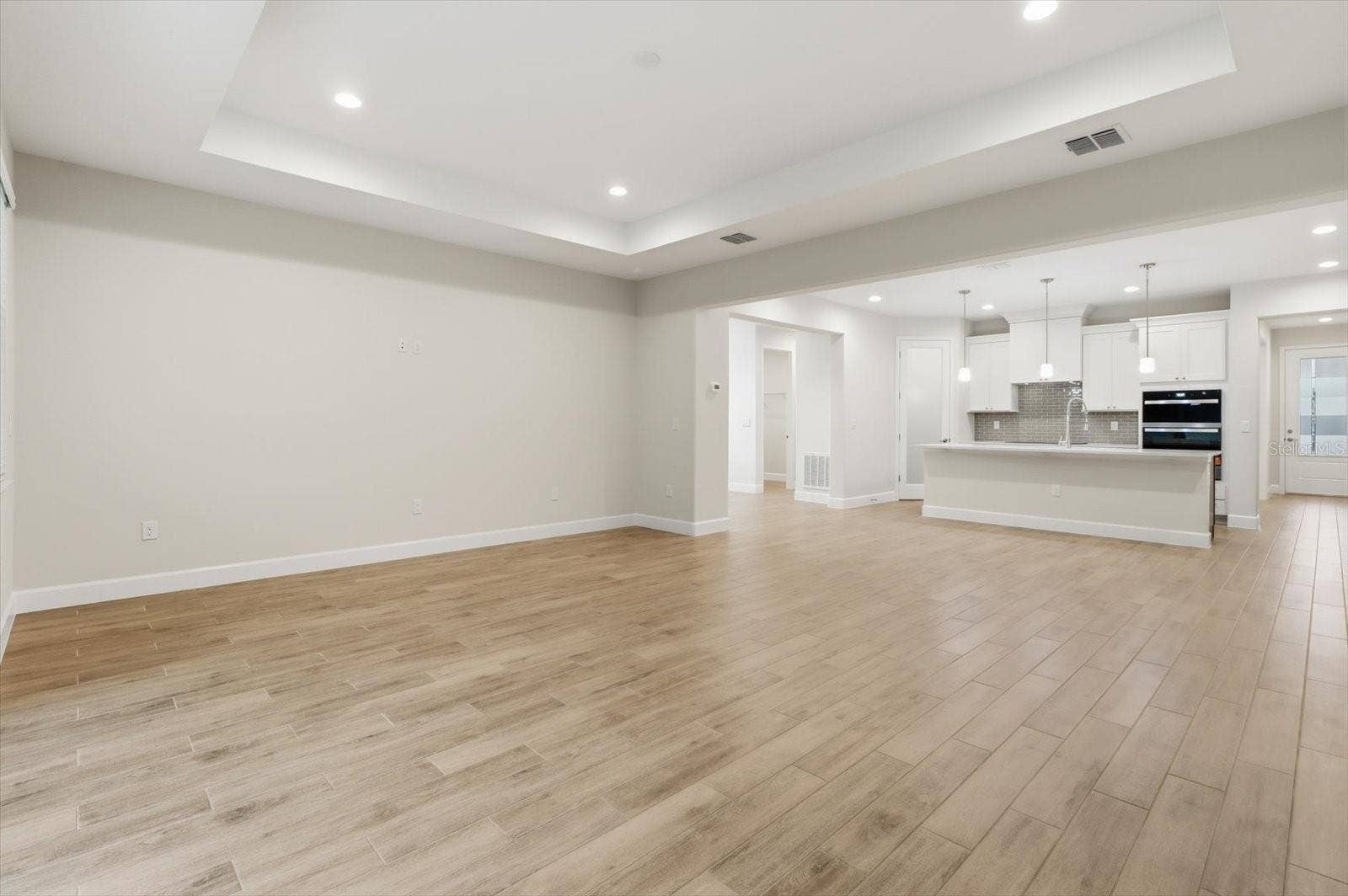 Welcome to the great room with tray ceilings!