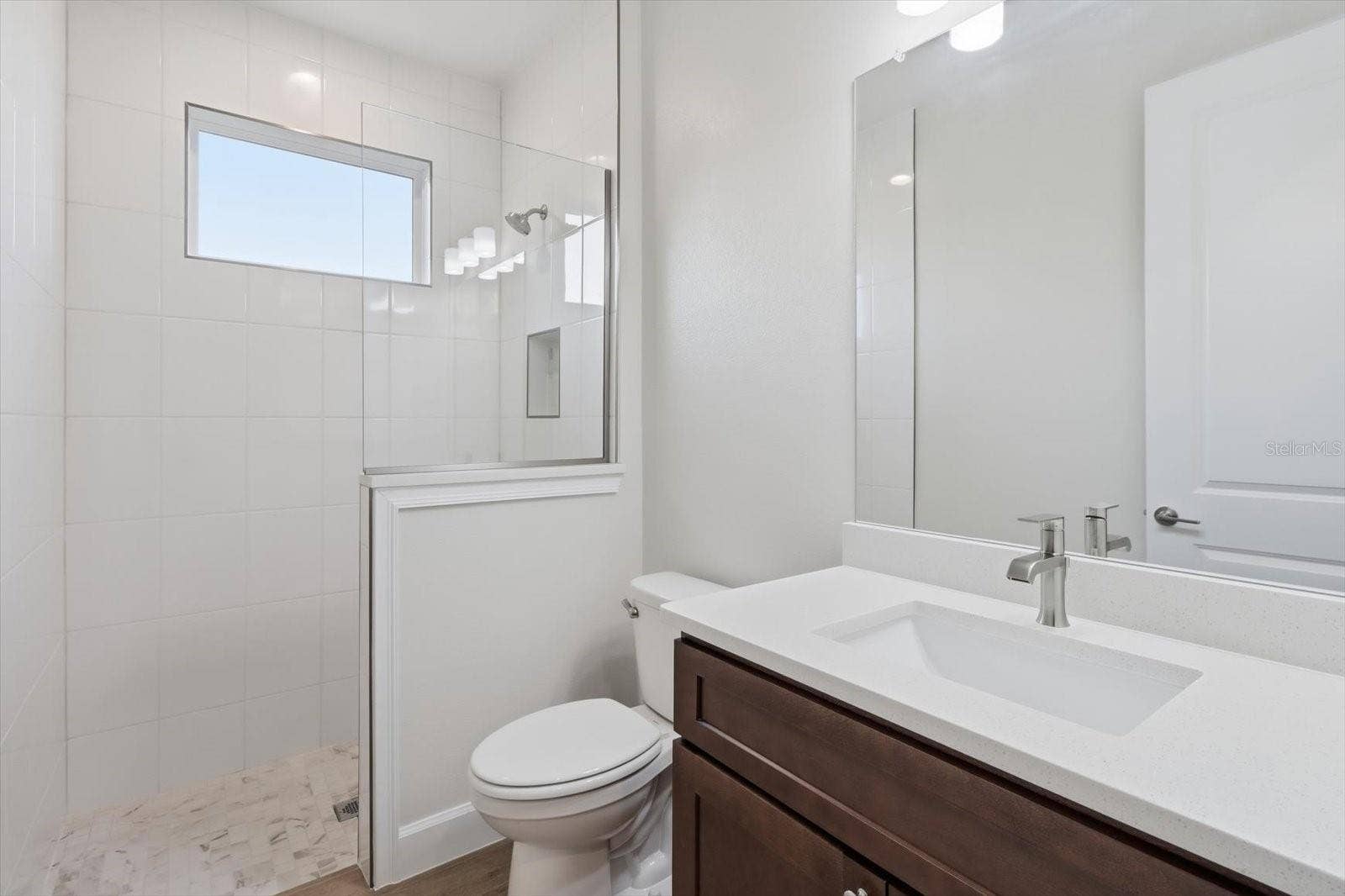 Bathroom 3 with a tiled walk in shower.