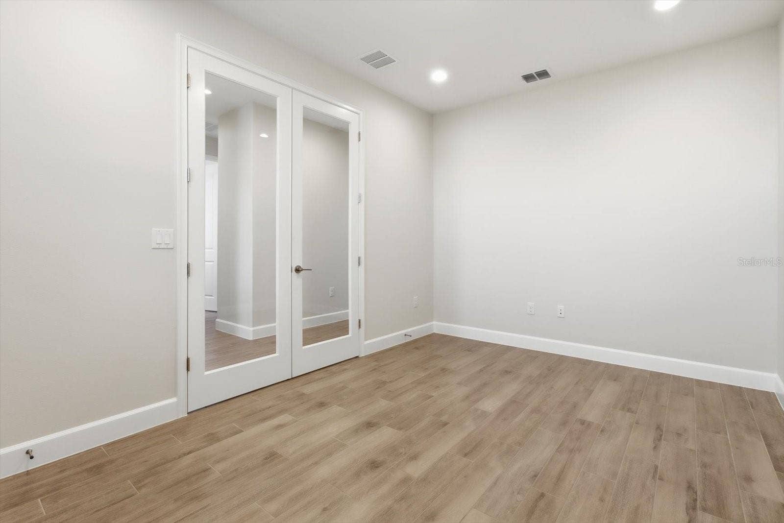 Flex room entrance just off of the foyer, upgraded glass doors.