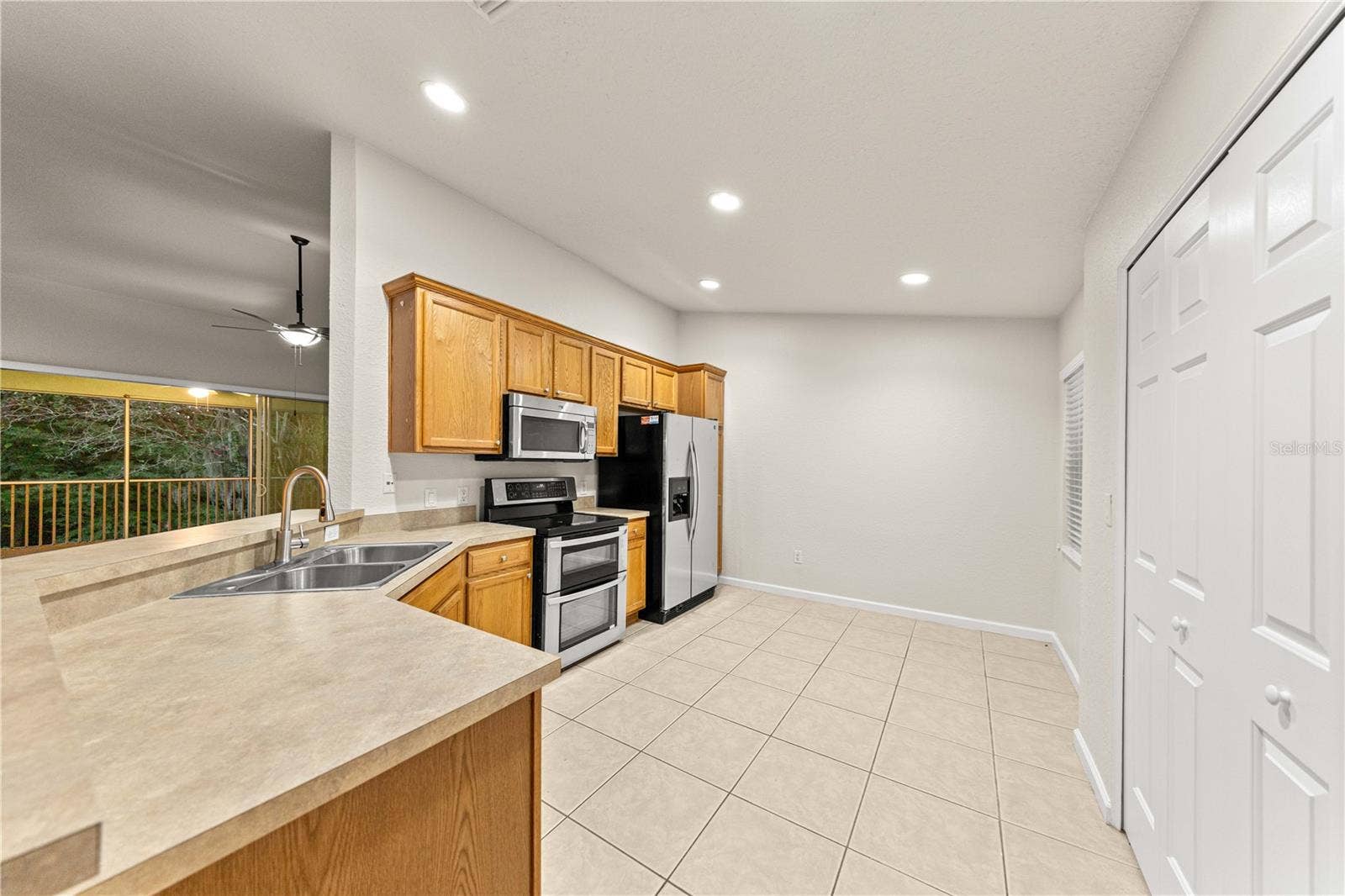 Large Kitchen with In-Unit laundry hookups and overlooks Living Room and features a double oven!
