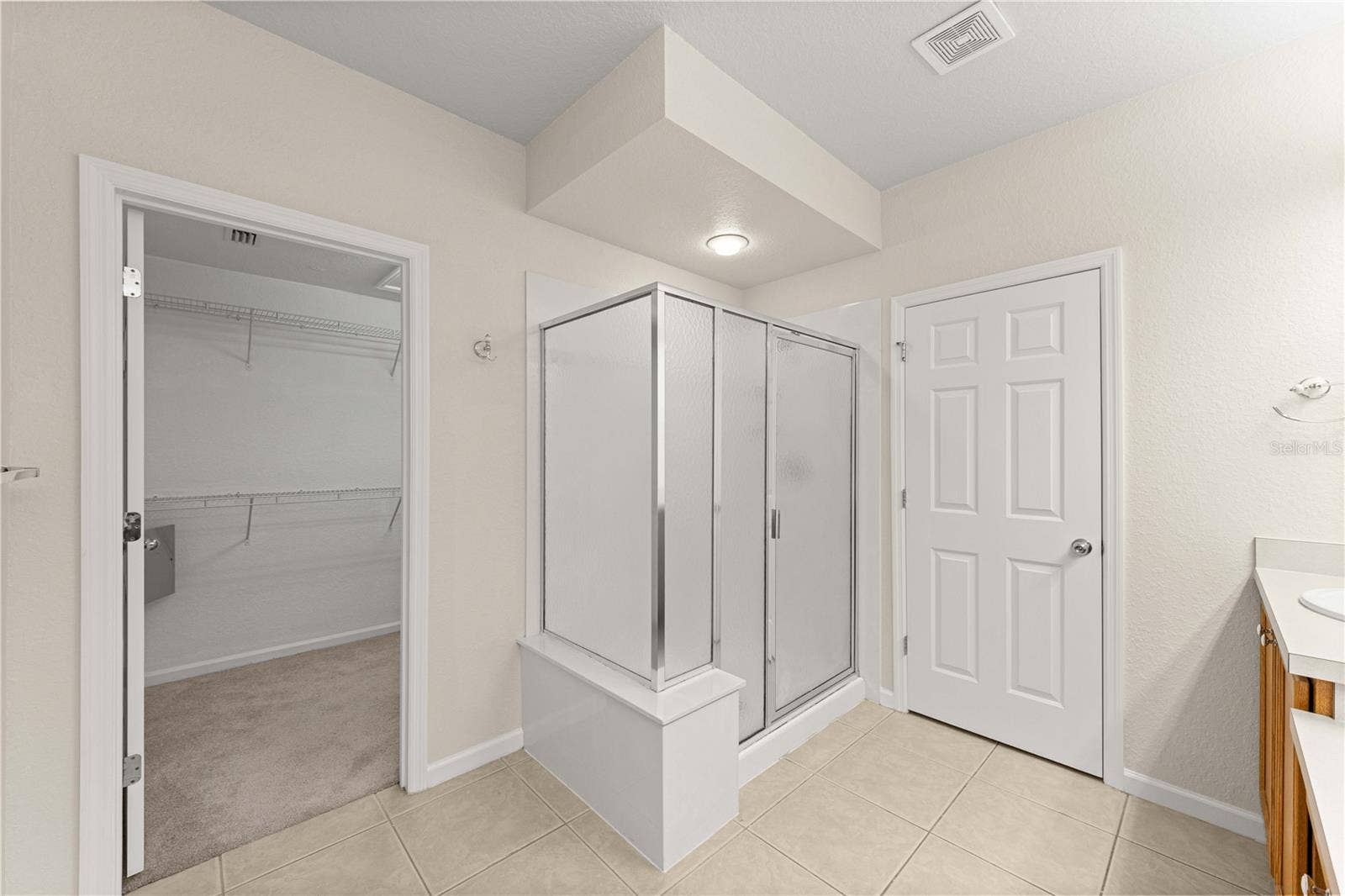 Primary en suite bathroom with walk in shower
