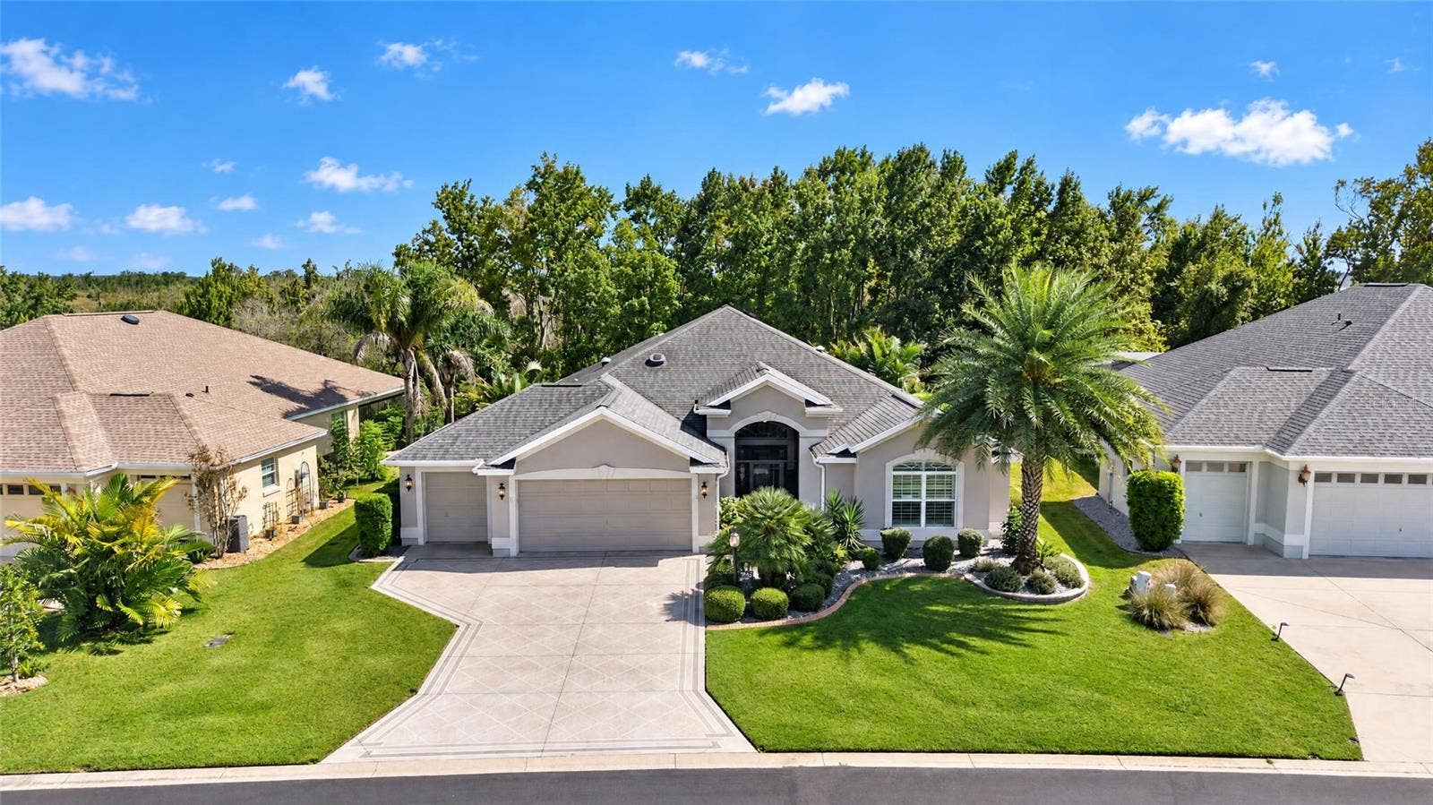 2 CAR PLUS GOLF CART GARAGE, PAINTED DRIVEWAY, ENHANCED LANDSCAPING