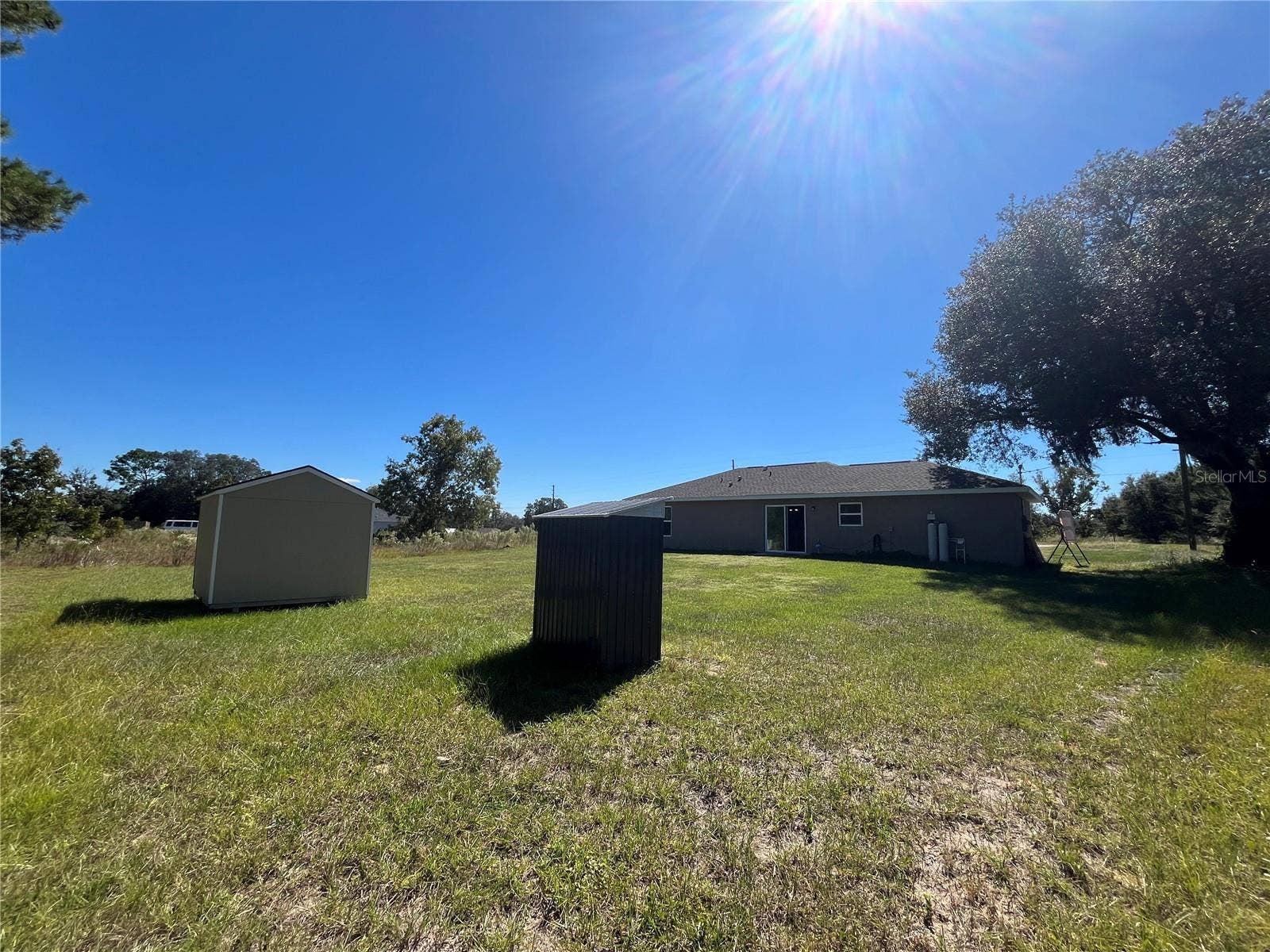 115 MALAUKA RADIAL, Ocklawaha, FL 32179 Metal Well Pump House next to Shed in Backyard