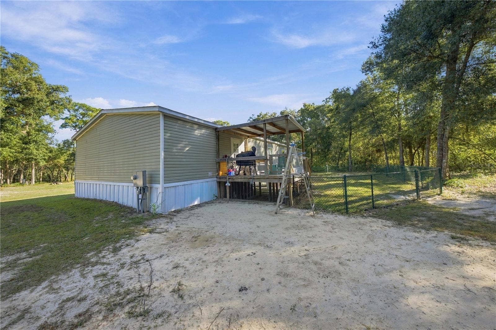 9921 SE 160TH AVENUE, Ocklawaha, FL 32179 BACK OF HOME